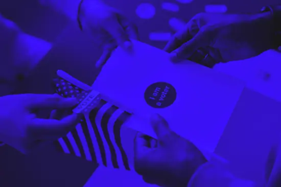 A blue image of a man holding a piece of paper that says I am a voter