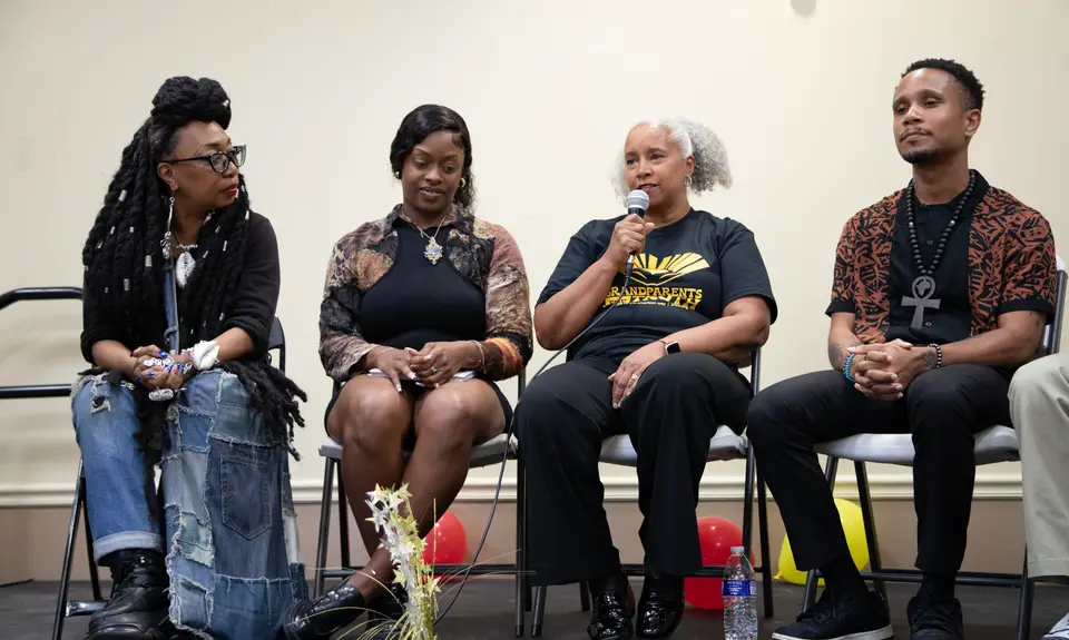 Speakers gather on stage to discuss the importance of teaching Black history