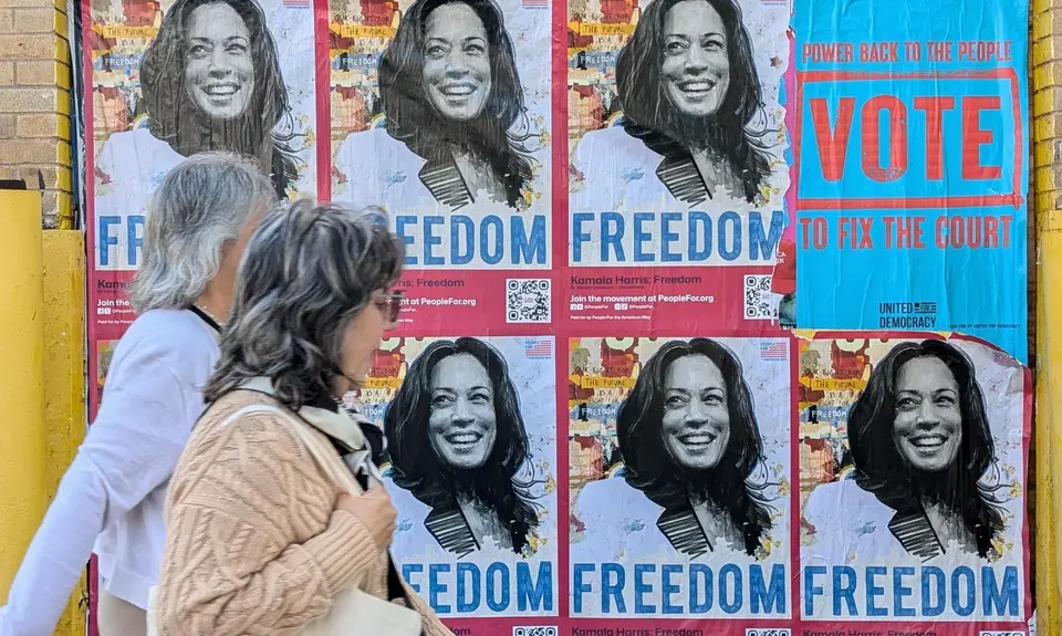 "Kamala Harris: Freedom" posted with people walking by