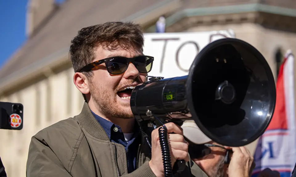 Nick Fuentes with bullhorn at a Stop The Steal rally