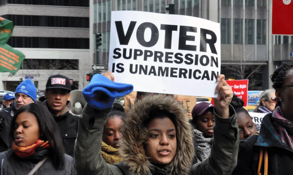 Occupy Wall Street joined the NAACP as thousands marched in midtown Manhattan on December 10, 2011 to defend voting rights.