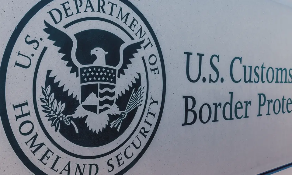 The seal of the U.S. Department of Homeland Security on a sign for U.S. Customs and Border Protection