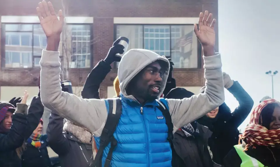 DeRay McKesson raises his hands in the “Hands up, don’t shoot” gesture in the early days of the Ferguson protests.