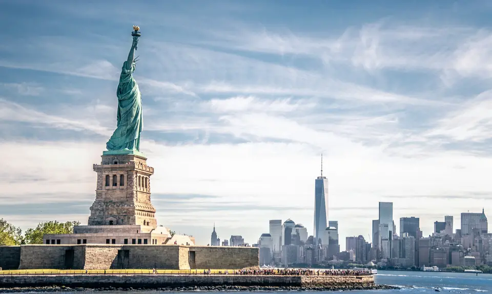 The Statue of Liberty with the New York City skyline in the background