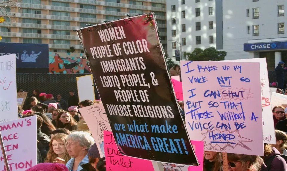 photo of people supporting immigration rights holding up signs