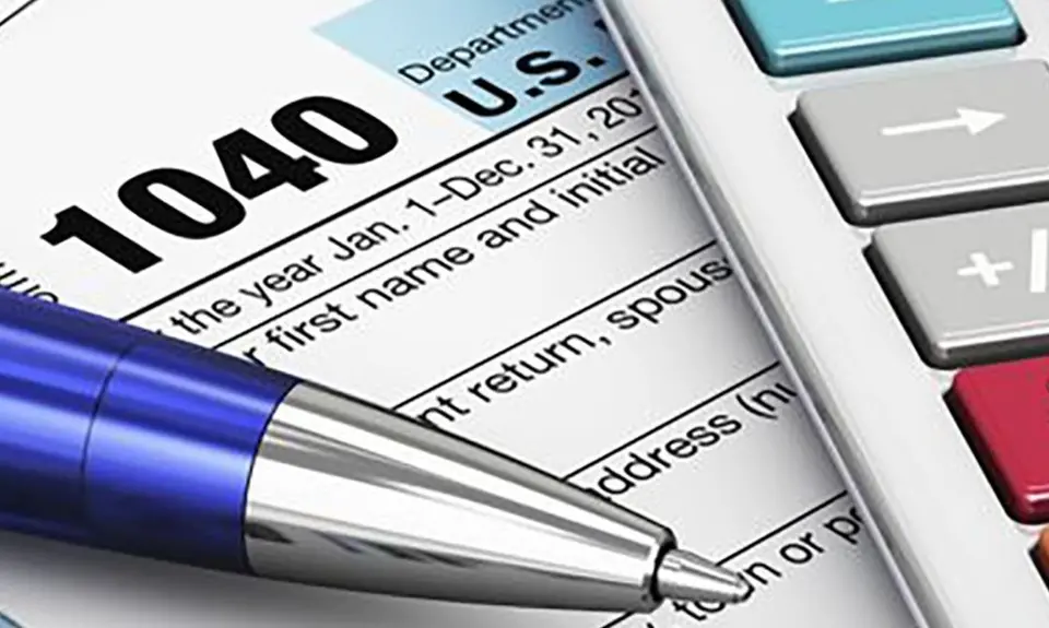 picture of tax form with pen and calculator