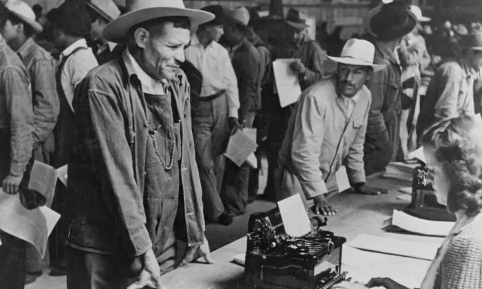 Mexican farm workers line up as they are registered to work in the US through the Bracero program.