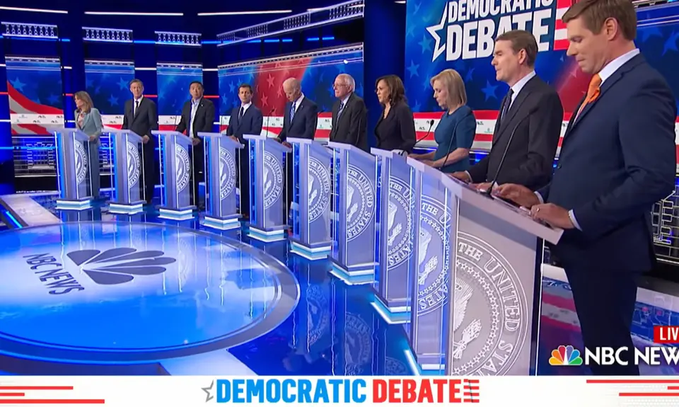 Candidates stand at their podiums during a Democratic presidential debate