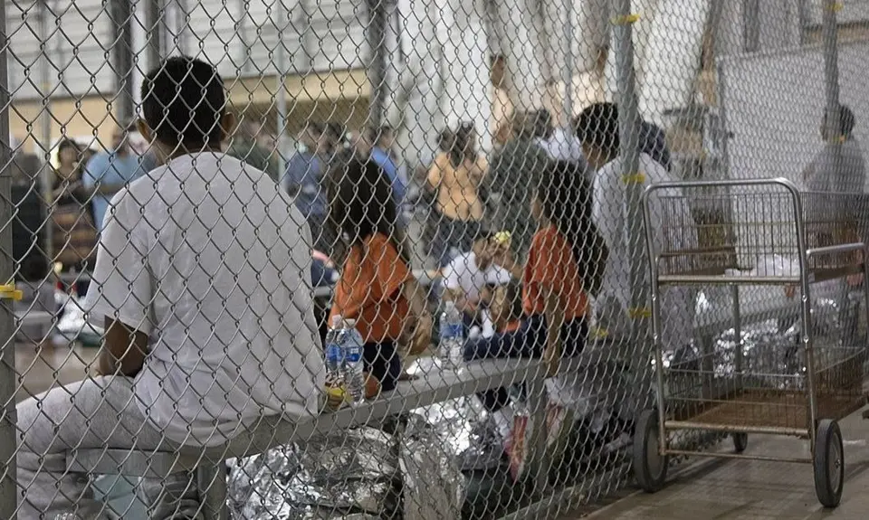 immigrant children crowded together in detention center