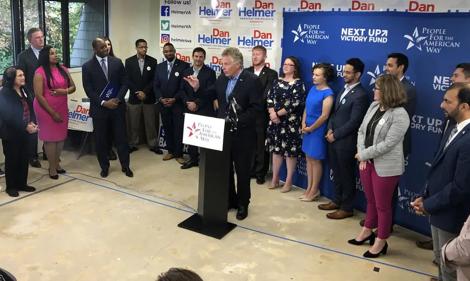 Former VA Gov. Terry McAuliffe at the speaker's podium at PFAW's Next Up 2019 Virginia kickoff event.