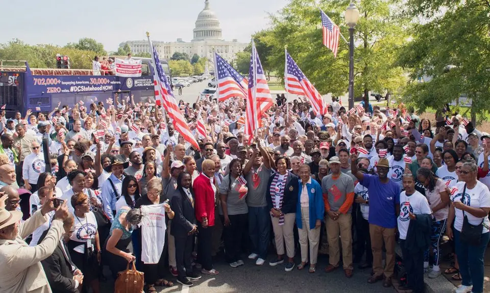 A group of activists pose with American flags