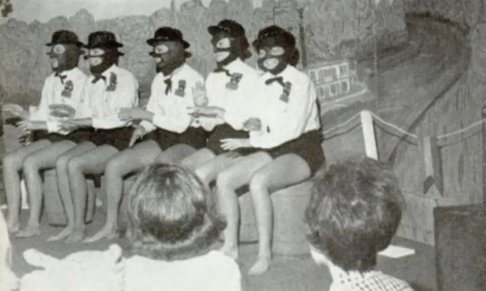 Alabama Governor Kay Ivey participates in a skit with other students in blackface.