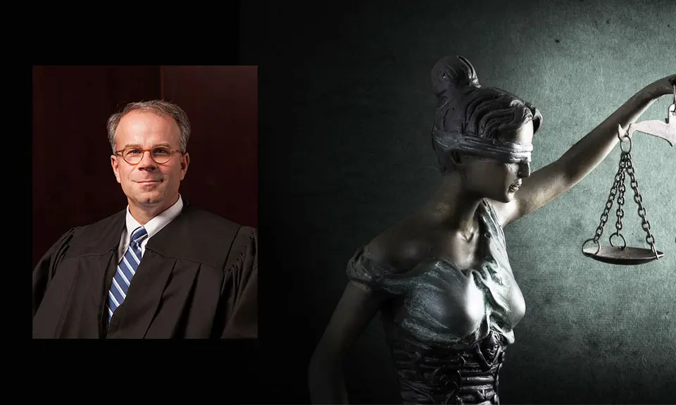 Michael Scudder superimposed on an image of Lady Justice.