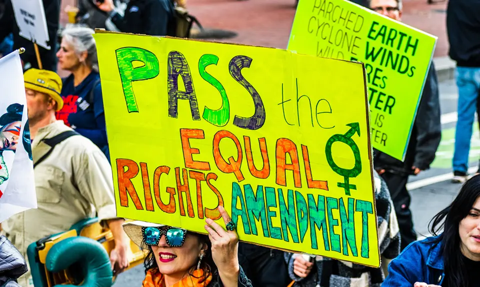 Participant of the 2020 Women's March - San Francisco holds a sign reading "Pass the Equal Rights Amendment!"