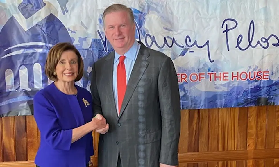 PFAW President Michael Keegan shakes hands with Nancy Pelosi