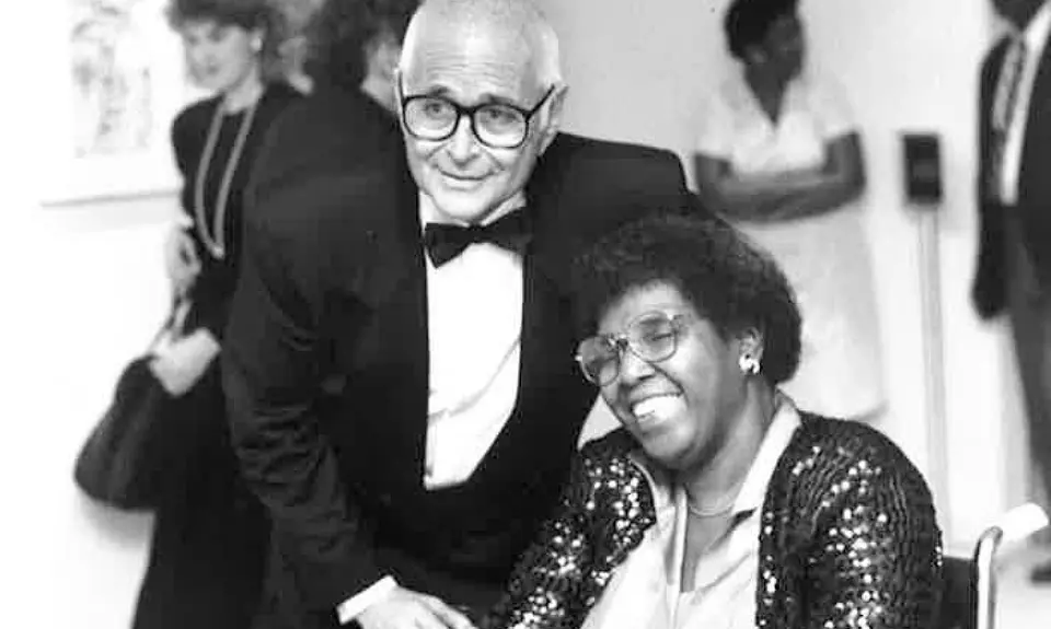 Norman Lear stands next to Barbara Jordan.