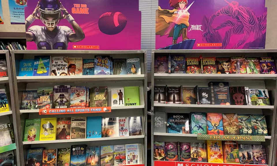 Shelves of books at a Scholastic book fair.