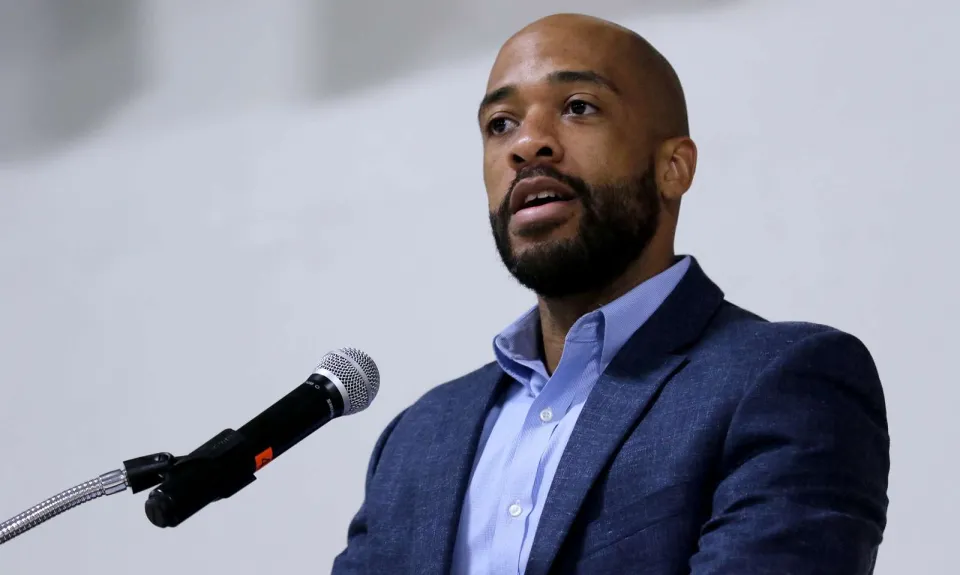 Mandela Barnes standing at a microphone.