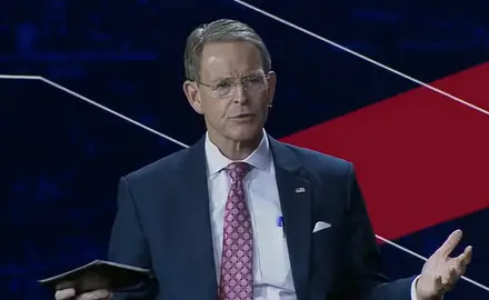 Tony Perkins speaking while seated on stage at Pray Vote Stand conference