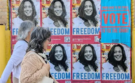 "Kamala Harris: Freedom" posted with people walking by