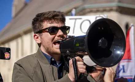 Nick Fuentes with bullhorn at a Stop The Steal rally