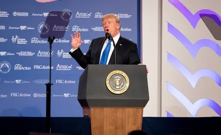 Donald Trump speaking in front of teleprompter