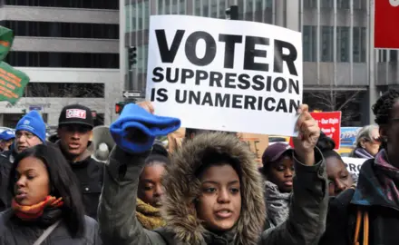 Occupy Wall Street joined the NAACP as thousands marched in midtown Manhattan on December 10, 2011 to defend voting rights.