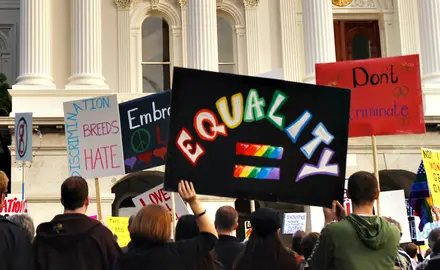 A sign being held at a protest which reads "EQUALITY"