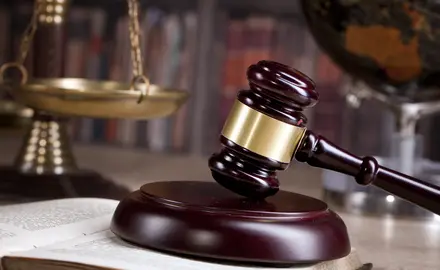 A gavel sitting on a table.