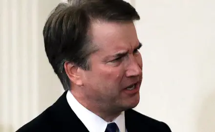 A closeup of Brett Kavanaugh furrowing his brow