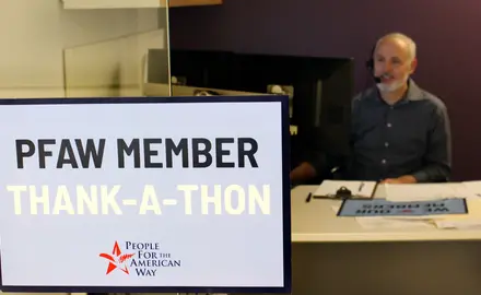 A Sign that says "PFAW Member Thank-a-Thon" in front of a PFAW staff member's desk