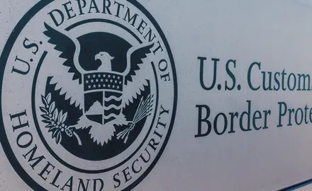 The seal of the U.S. Department of Homeland Security on a sign for U.S. Customs and Border Protection