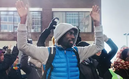 DeRay McKesson raises his hands in the “Hands up, don’t shoot” gesture in the early days of the Ferguson protests.