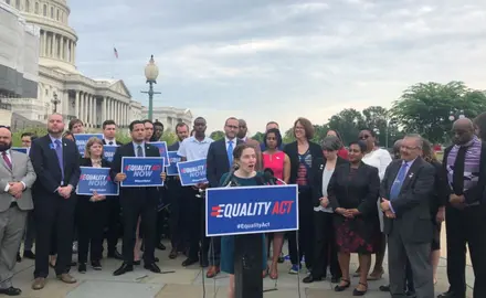 Jen Herrick speaks in front of a group of activists outside the U.S. Capitol Building in support of the Equality Act