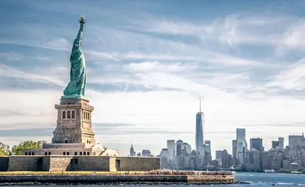 The Statue of Liberty with the New York City skyline in the background