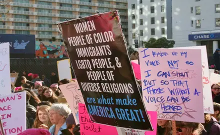 photo of people supporting immigration rights holding up signs