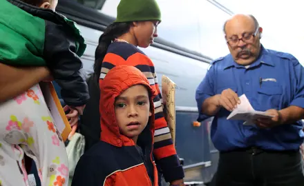 A young Central American boy who entered the U.S. illegally boards a bus with his mother to go to their sponsor where they'll wait for an asylum hearing.