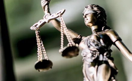 A statue of Lady Justice holding scales and wearing a blindfold.