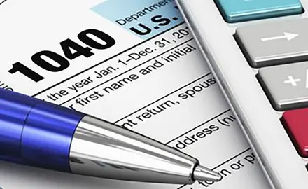 picture of tax form with pen and calculator