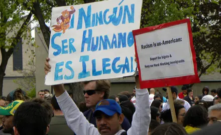 Activists hold signs protests racism