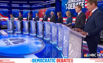 Candidates stand at their podiums during a Democratic presidential debate