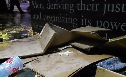 Cardboard boxes on the ground near the U.S. District Court in Seattle used by homeless individuals