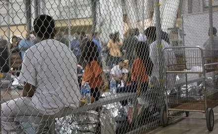 immigrant children crowded together in detention center