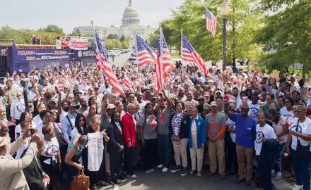 A group of activists pose with American flags