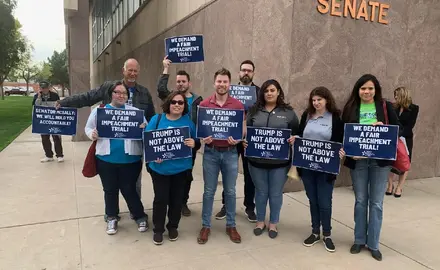 PFAW members and local activists rally outside of the Arizona Capitol to demand that Martha McSally support calling witnesses in impeachment