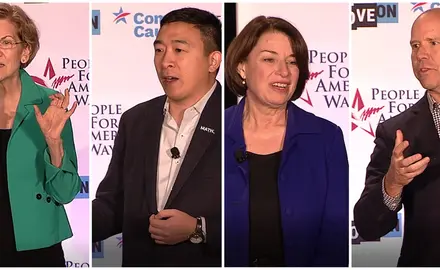 Presidential candidates Amy Klobuchar, John Delaney, Elizabeth Warren and Andrew Yang at the "We the People" democracy forum in Des Moines, Iowa.