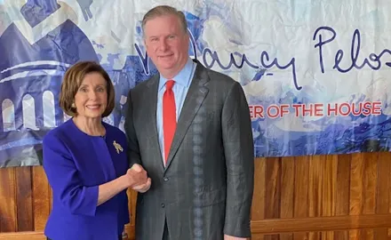 PFAW President Michael Keegan shakes hands with Nancy Pelosi