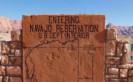 At Grand Canyon National Park, a rock sign displays a map area of the Navajo Nation, one of many Native American tribes that are battling higher rates of the coronavirus.