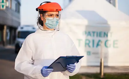 Health care worker in protective gear.