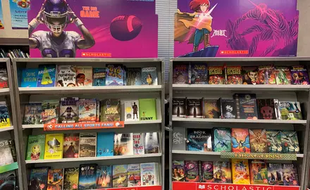 Shelves of books at a Scholastic book fair.